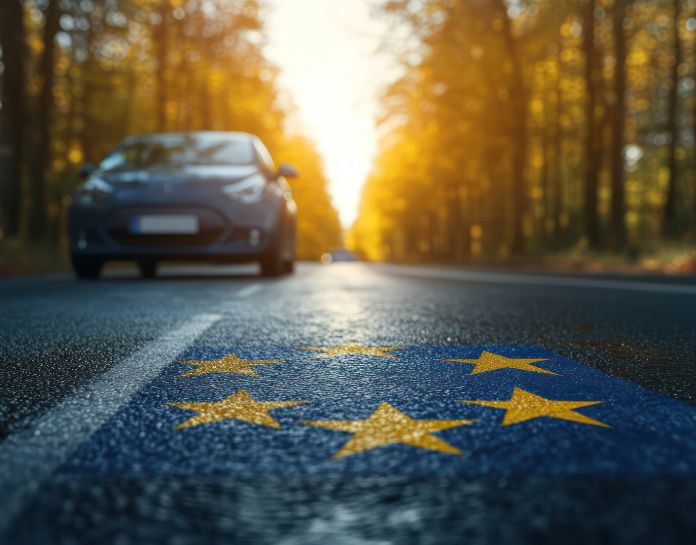 voiture electrique roule - route avec drapeau union europeenne